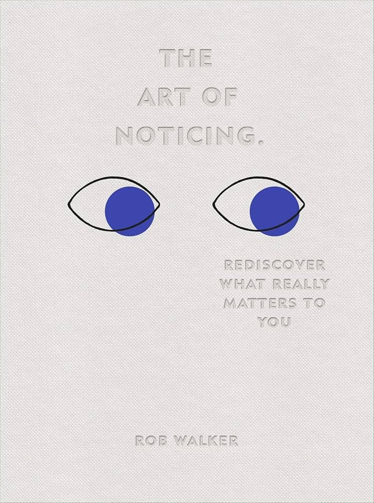 Embossed white cover of The Art of Noticing with two blue eyes
